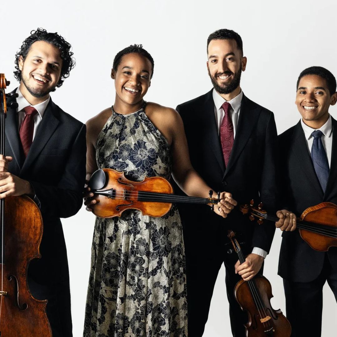 a quartet of musician on a green bcakground